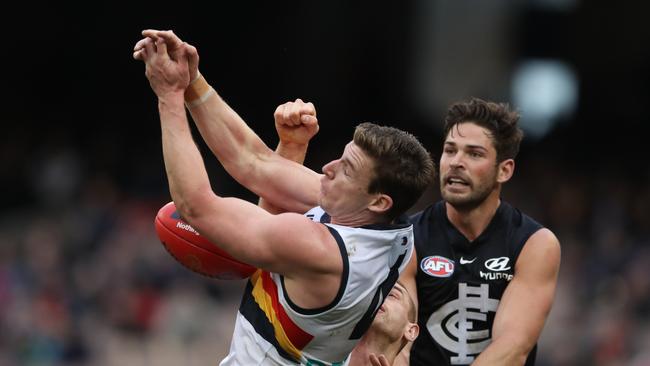 Carlton players spoil a Josh Jenkins marking attempt in their round 19 clash at the MCG. Picture: AAP Image/David Crosling