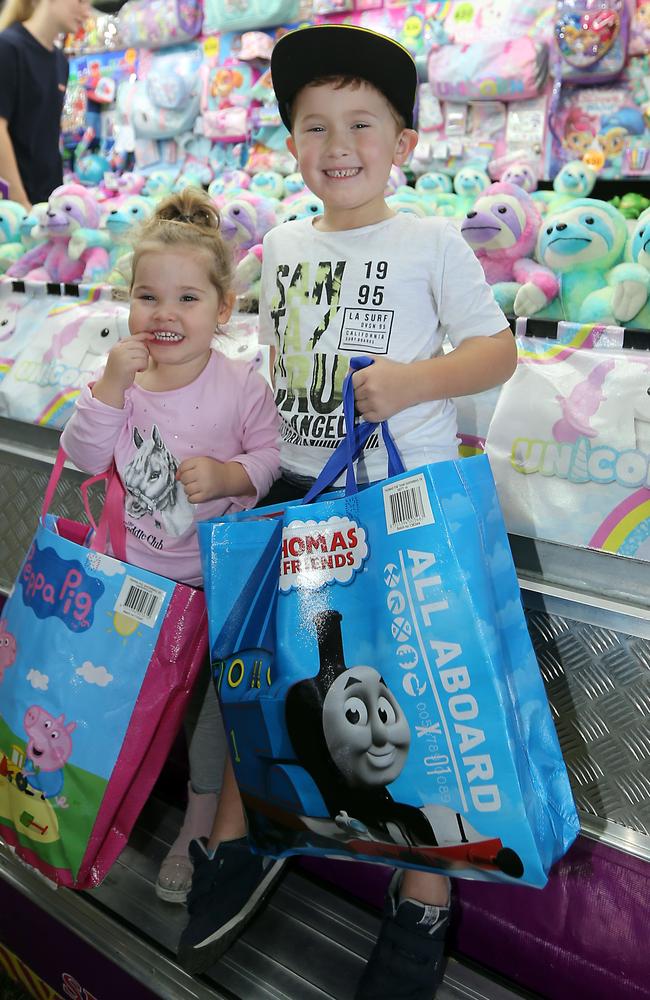 Cora and Jai Browne pick up a couple of showbags at the 2019 Gold Coast Show. Picture: Richard Gosling