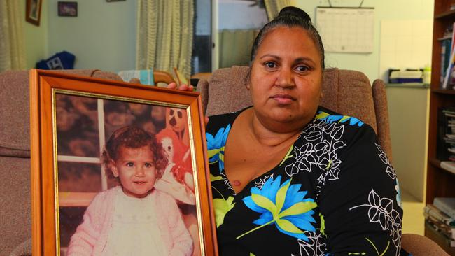 Michelle Jarrett holds a picture of niece Evelyn Greenup. Picture: Frank Redward