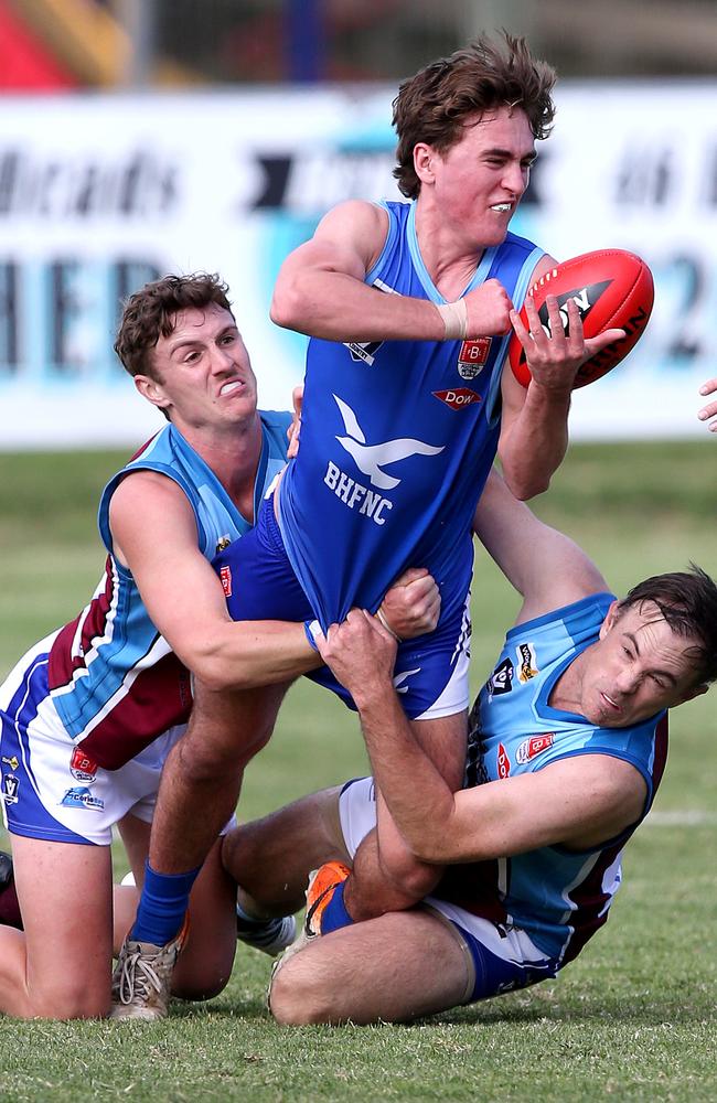 VBFL: Barwon Heads v Modewarre. Barwon Heads Charlie Hurst gets the hand pass way under pressure. Picture: Mike Dugdale