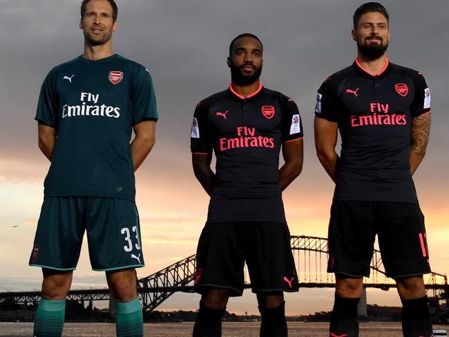 (L to R) Arsenal FC players Laurent Koscielny, Petr Cech, Alex Lacazette, Olivier Giroud, Mesut Ozil and Nacho Monreal pose for a photograph as they display the team's third kit on  Fort Denison in Sydney on Wednesday, July 12, 2017. Arsenal play friendly matches against Sydney FC and the Western Sydney Wanderers this week, the team's first visit to Australia in 40 years. (AAP Image/Paul Miller) NO ARCHIVING