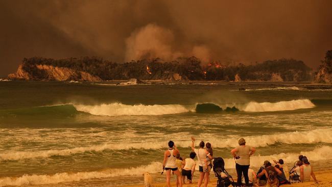 Watching the inferno just south of Batemans Bay. Picture: Alex Coppel.