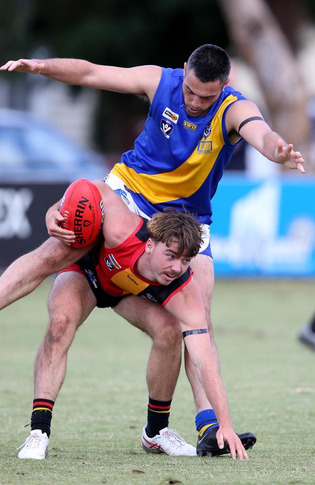 GFL: St Joseph's v North Shore. St Josephs Tanner Owen under pressure after marking by North Shore's Phil Bellchambers. Picture: Mike Dugdale