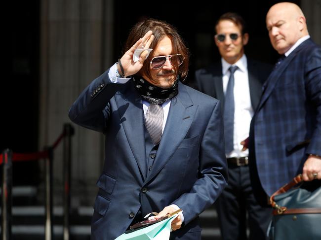 Johnny Depp waved to fans as he arrived at a London court. Picture: AFP