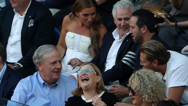 Former Telstra boss Andy Penn sitting behind Peter Costello. Picture: Mark Stewart