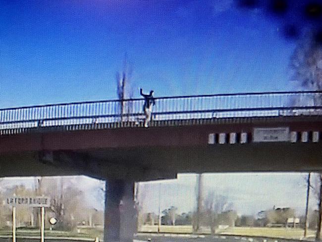 Man throwing rocks of Dubbo bridge. Photo: Supplied.