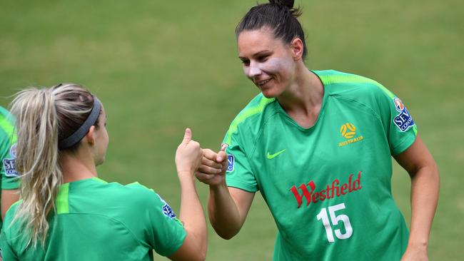 Gielnik (R) shares a laugh at training. Picture: AFP