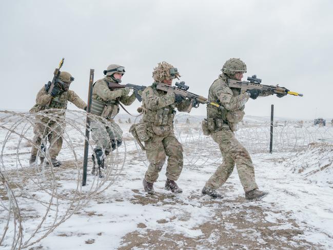 SMARDAN, ROMANIA - FEBRUARY 17: British soldiers practice an assault on February 17, 2025 in Smardan, Romania. The UK's 1st Division is commanding land forces during Exercise Steadfast Dart, as NATO Allied Reaction Force (ARF) training continues in Romania. The ARF was established in July 2024 amid a restructuring of the Alliance's high-readiness forces, with the capability of rapidly reinforcing NATO's eastern flank. The exercise includes 10,000 service personnel from nine nations, carried out across Romania, Greece, and Bulgaria during January and February. Steadfast Dart marks the first full-scale operational deployment of ARF, and this week coincides with the third anniversary of Russia's large-scale invasion of Ukraine in 2022. (Photo by Andrei Pungovschi/Getty Images)