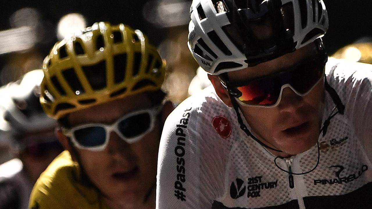 Great Britain's Geraint Thomas (L), wearing the overall leader's yellow jersey, and Great Britain's Christopher Froome ride during the 15th stage of the 105th edition of the Tour de France cycling race, between Millau and Carcassonne on July 22, 2018.  / AFP PHOTO / Marco BERTORELLO