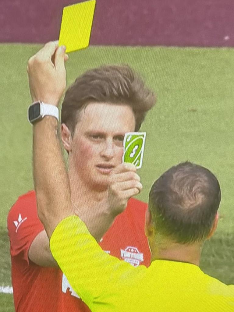 Comedian Max Fosh produces an UNO reverse card in response to being booked in a charity match.