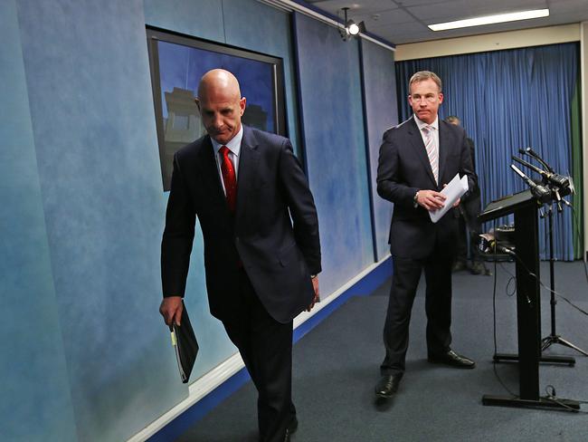 treasurer Peter Gutwein, left, and premier Will Hodgman leave after speaking to the media about the pay freeze