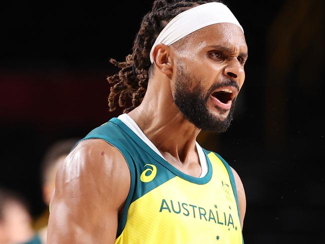 SAITAMA, JAPAN - JULY 31: Patty Mills #5 of Team Australia celebrates during Australia's Men's Basketball Preliminary Round Group B game against Germany on day eight of the Tokyo 2020 Olympic Games at Saitama Super Arena on July 31, 2021 in Saitama, Japan. (Photo by Gregory Shamus/Getty Images)