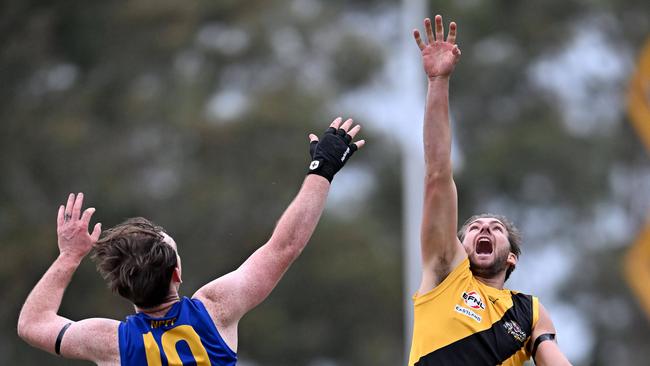 Noble Park’s Kieren Byers and Balwyn’s Chevy Andersen do battle in the ruck. Picture: Andy Brownbill