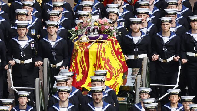 The Queen's coffin, borne on the State Gun Carriage of the Royal Navy and adorned with the Imperial State Crown, Orb and Sceptre, travels along The Mall. Picture: Chip Somodevilla/Getty Images