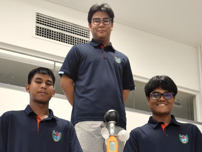 Darwin High School students Monishi Rangchak Tripura, Pothik Vincent Mondol, and Mohammad Niyaz Hasan have devised a strategy to cool rooms cheaply through apparent temperature optimisation. Picture: Sierra Haigh