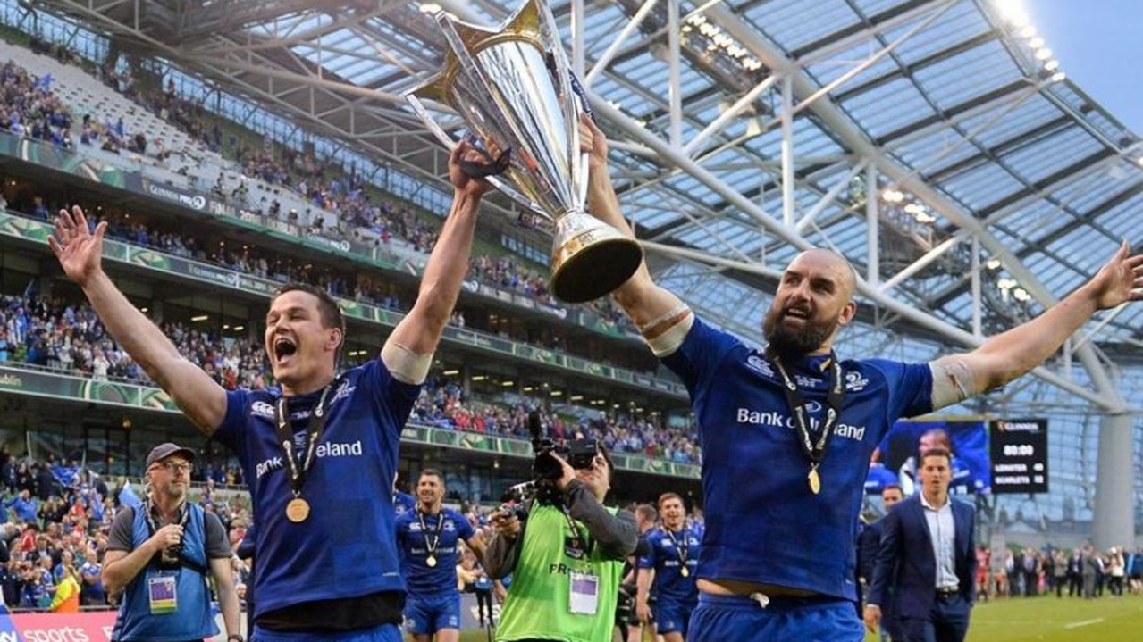 Former Wallaby Scott Fardy lifts the Pro14 trophy with Irish fly-half Johnny Sexton after Leinster defeated Scarlets at the Aviva Stadium.