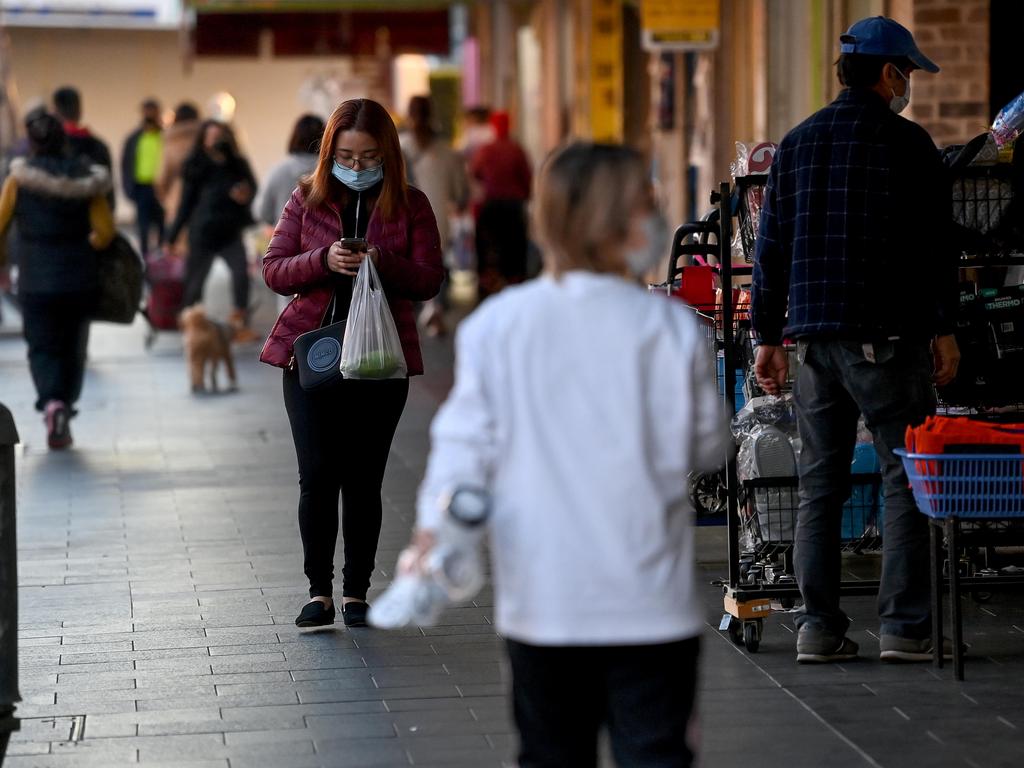 People wearing face masks walk the main shopping strip of Bankstown in Sydney. Picture: NCA NewsWire/Bianca De Marchi