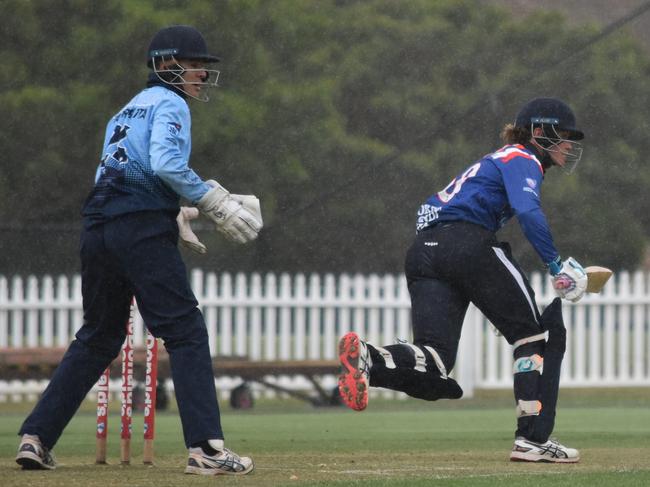 Aston Weir plays a shot in the rain. Picture: Sean Teuma