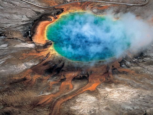 This undated photo provided by Robert B. Smith shows the Grand Prismatic hot spring in Yellowstone National Park's that is among the park's myriad hydrothermal features created by the fact that Yellowstone is a supervolcano, the largest type of volcano on Earth. Scientists have discovered a new, deeper reservoir of partly molten rock beneath the Yellowstone supervolcano. But they said the find doesn’t change the chances of a volcanic eruption. (Robert B. Smith via AP)