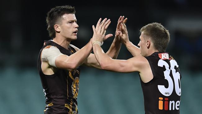 Mitch Lewis (left) celebrates a goal with Hawks teammate Dylan Moore. Picture: Albert Perez/AFL Photos/via Getty Images