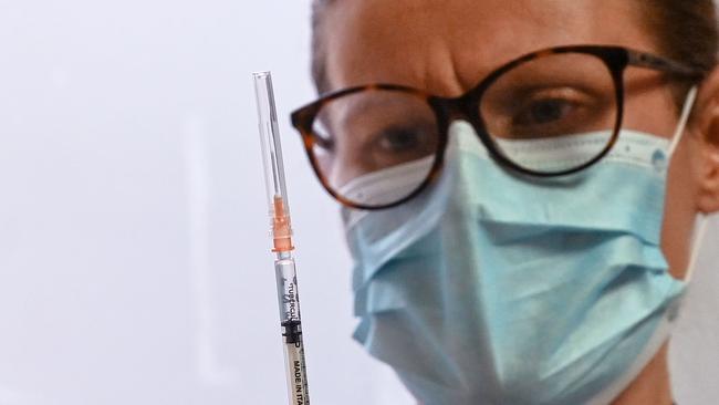 A doctor prepares a syringe to administer a dose of the Pfizer-BioNtech COVID-19 vaccine to a fellow doctor on January 5, 2021. Picture: Denis Charlet/AFP