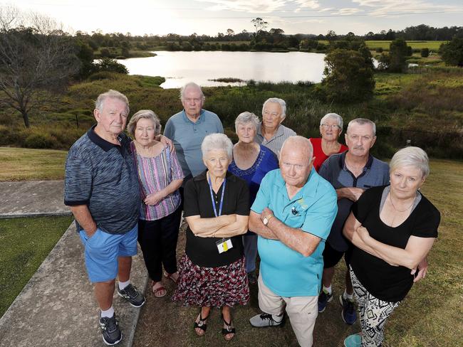 Residents of the Palm Lake Resort in Eagleby: Alec Raymer and Marilyn Goodwin, Bob Beattie, Sandra Tait, Eric and Joan Griffiths, Bruce Tait, Pat Dubbelman, and Bill and Judy Lamond are unhappy with the proposal of the Coomera Connector road being build in their backyard. (Image/Josh Woning)