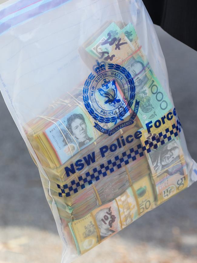 An evidence bag containing large amounts of cash removed from one of the Sydney properties. Picture: Gaye Gerard