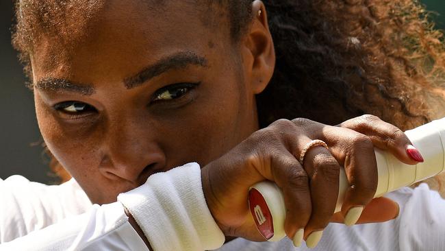 US player Serena Williams reacts against Germany's Julia Goerges during their women's singles semi-final match on the tenth day of the 2018 Wimbledon Championships at The All England Lawn Tennis Club in Wimbledon, southwest London, on July 12, 2018. Williams won the match 6-2, 6-4. / AFP PHOTO / Oli SCARFF / RESTRICTED TO EDITORIAL USE