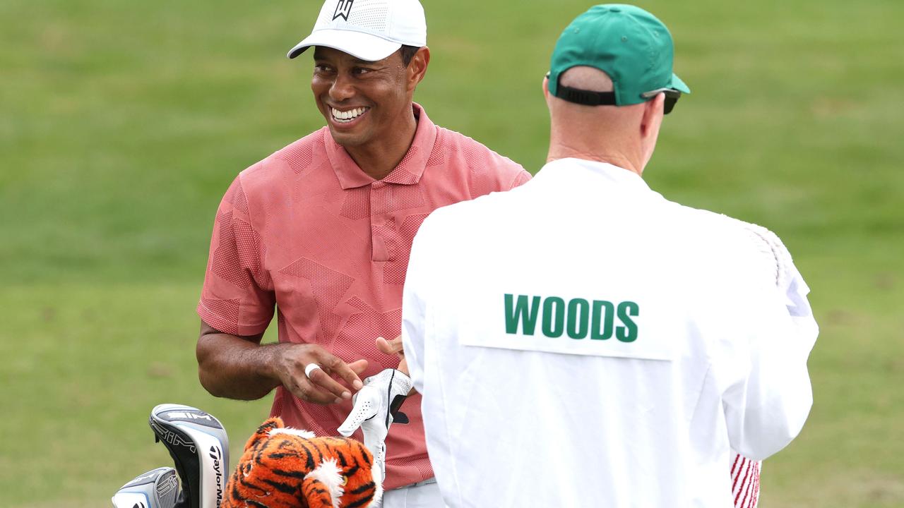 Tiger Woods is all smiles at Augusta, back to defend his Masters title. Picture: Jamie Squire/Getty Images/AFP