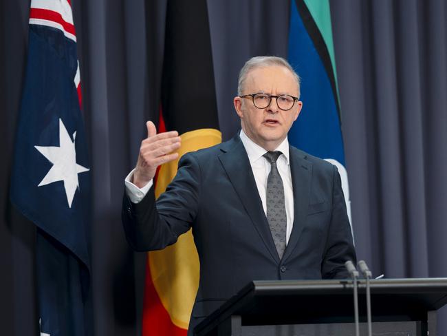 Prime Minister Anthony Albanese in front of the three flags at a press conference in Canberra. Picture: NewsWire / David Beach