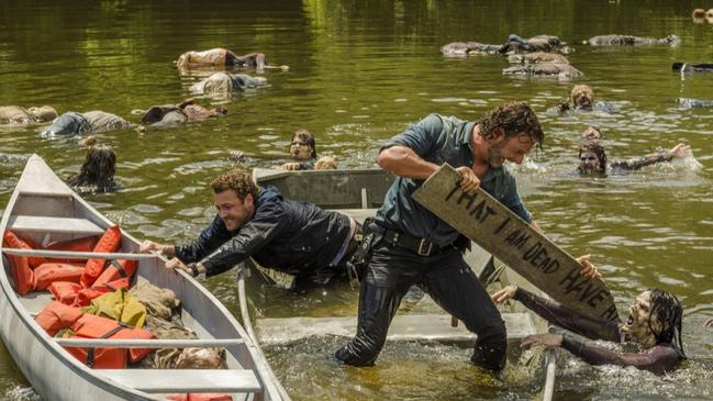 Andrew Lincoln and Ross Marquand have fun with the water Walkers.