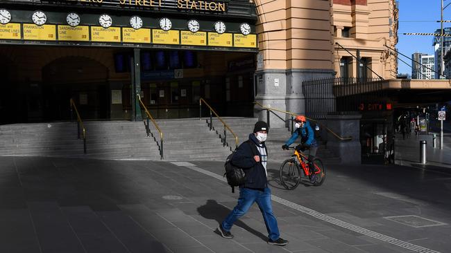 Socially distancing, washing your hands and wearing a mask has helped drive down Victoria’s daily coronavirus rate. Picture: William WEST/AFP.