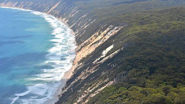 COLOURED SANDS: The Rainbow Beach coloured sands and dunes, looking south towards Double Island Point. Picture: Arthur Gorrie