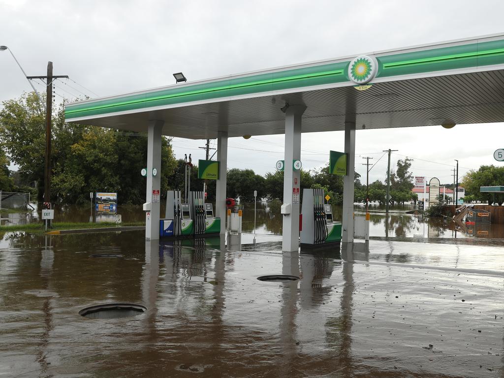 Camden a day after another flood in the area in two weeks . The BP service station and another were damaged again .