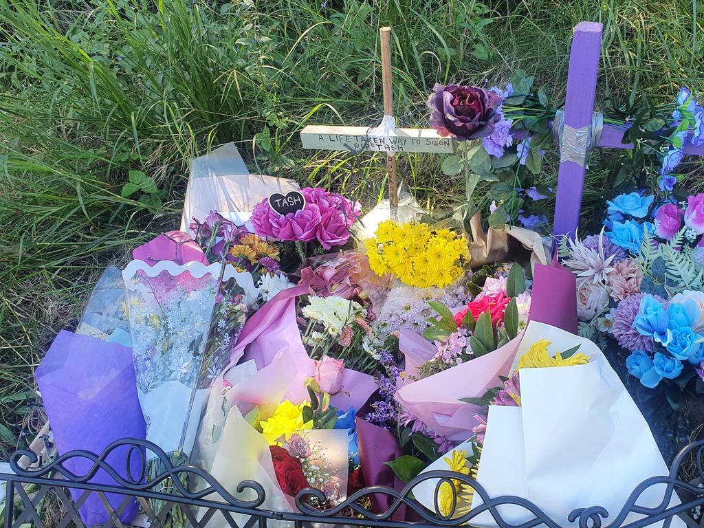 Tributes left at the scene on Boundary Road where Hervey Bay mum Tash Raven was killed in an alleged hit and run.