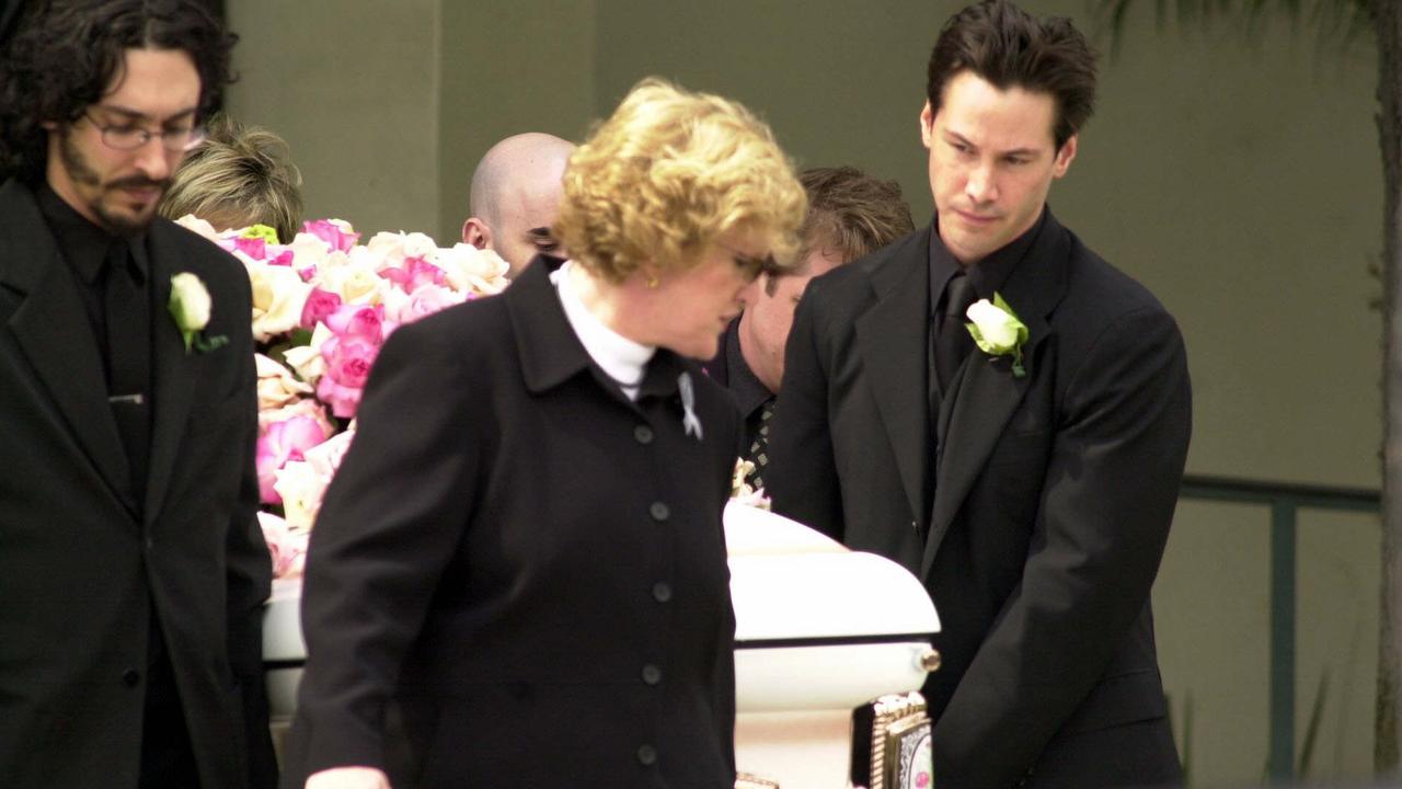 Actor Keanu Reeves carrying coffin at funeral on April 7, 2001 of his partner Jennifer Syme who was killed in road accident.