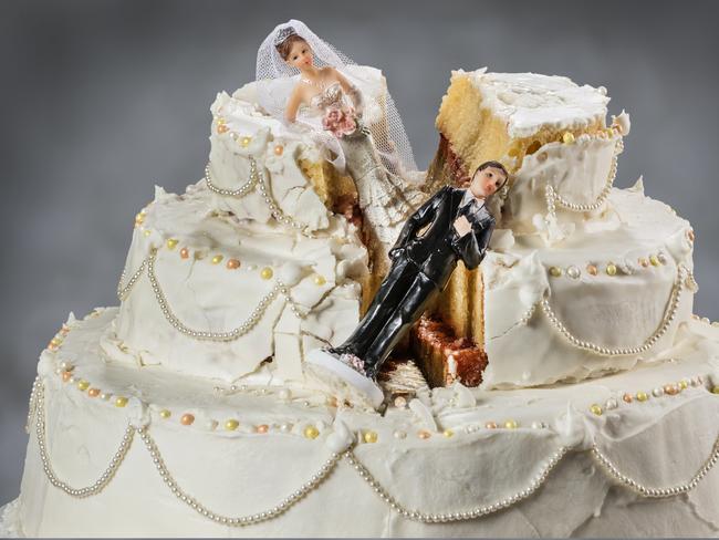 Spouses always seem to struggle to keep their relationship alive. divorce generic wedding cake.