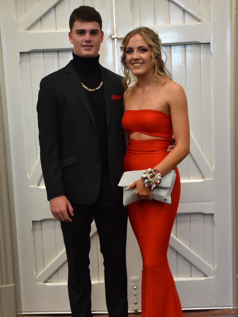 Morgan Byrne and Amber Goodwin celebrate graduation at the Assumption College formal.