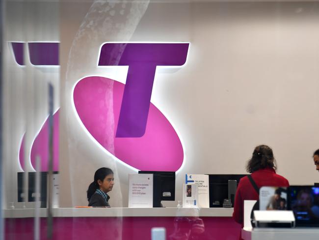 Customers and assistants are seen in a Telstra store in Sydney, Monday, July 8, 2018. Investors hoping to maintain their dividend payments from Telstra might be in for a shock, with Plato Investment Management managing director Don Hanson warning the rivers of gold are over for the telecommunications company. (AAP Image/Mick Tsikas) NO ARCHIVING