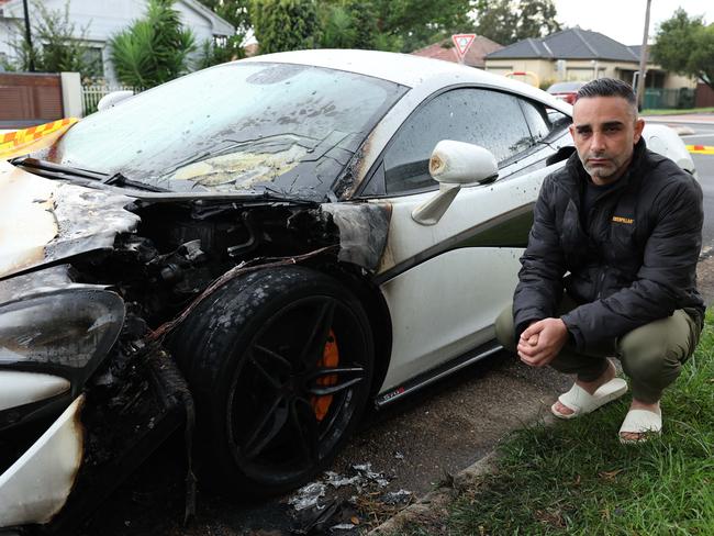 SUNDAY TELEGRAPH. MAY 4, 2024. Pictured on Road Road in Sefton this morning is Hamed Ajaje with his McLaren Supercar that was set on fire last night. Picture: Tim Hunter.