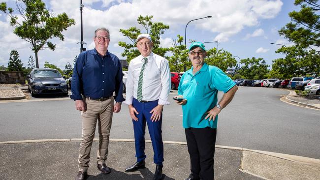 Federal Member for Petrie Luke Howarth, Moreton Bay Regional Councillor Peter Flannery and President of Mango Hill Progress Association Laurence Christie pose for a photograph for Smart Car Parking in North Lakes, Friday, February 21, 2020 (AAP Image/Richard Walker)