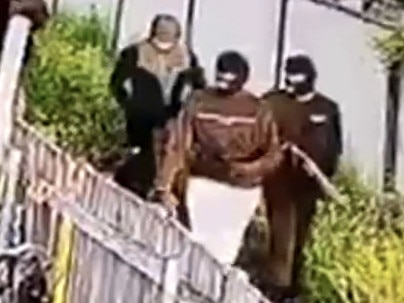 CCTV of masked gunmen who peppered the front yard of a home on Goldingham St, Tenambit on October 16, 2022 where Maddison Hickson was staying. Picture: Channel 7.