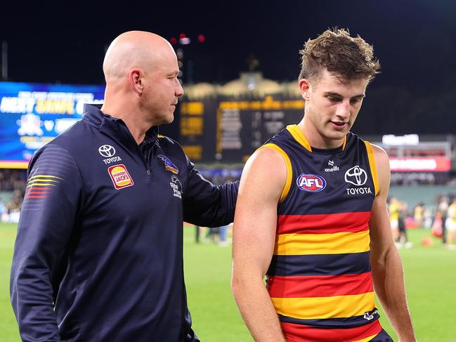 ADELAIDE, AUSTRALIA - JUNE 06: Matthew Nicks, Senior Coach of the Crows with Billy Dowling after the loss during the 2024 AFL Round 13 match between the Adelaide Crows and the Richmond Tigers at Adelaide Oval on June 06, 2024 in Adelaide, Australia. (Photo by Sarah Reed/AFL Photos via Getty Images)