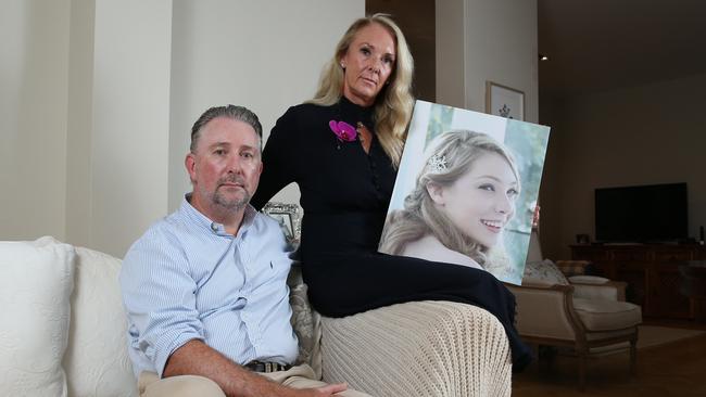 Bruce and Sophie Sedgwick with a photograph of daughter Amy. Picture: Britta Campion