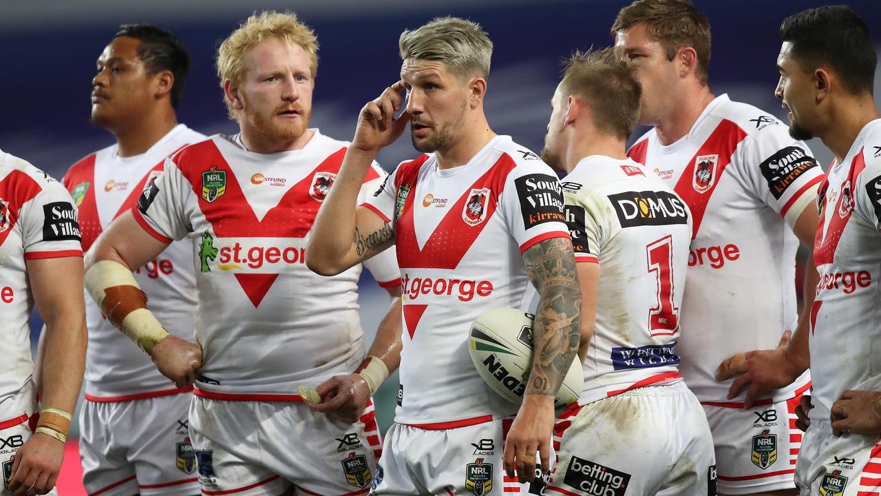 Dragons players look dejected during their loss to the Roosters.