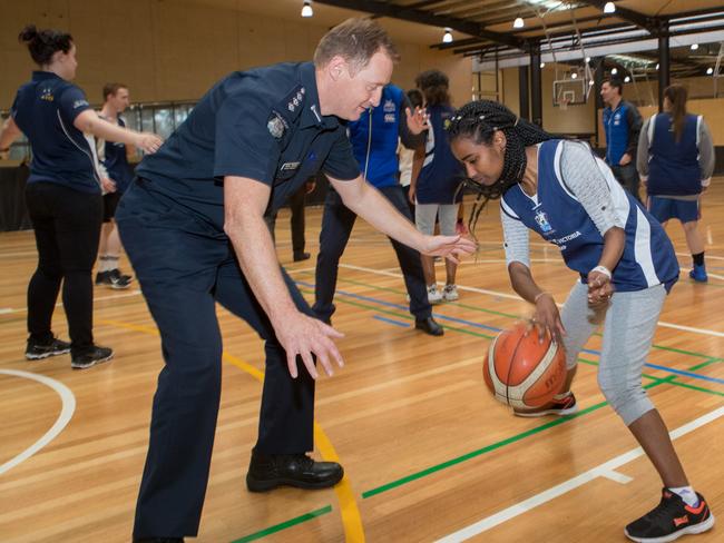 Acting Insp Peter Bitton plays ball with Buruktayt Zewdu during the “Game Changers” program. Picture: David Crosling