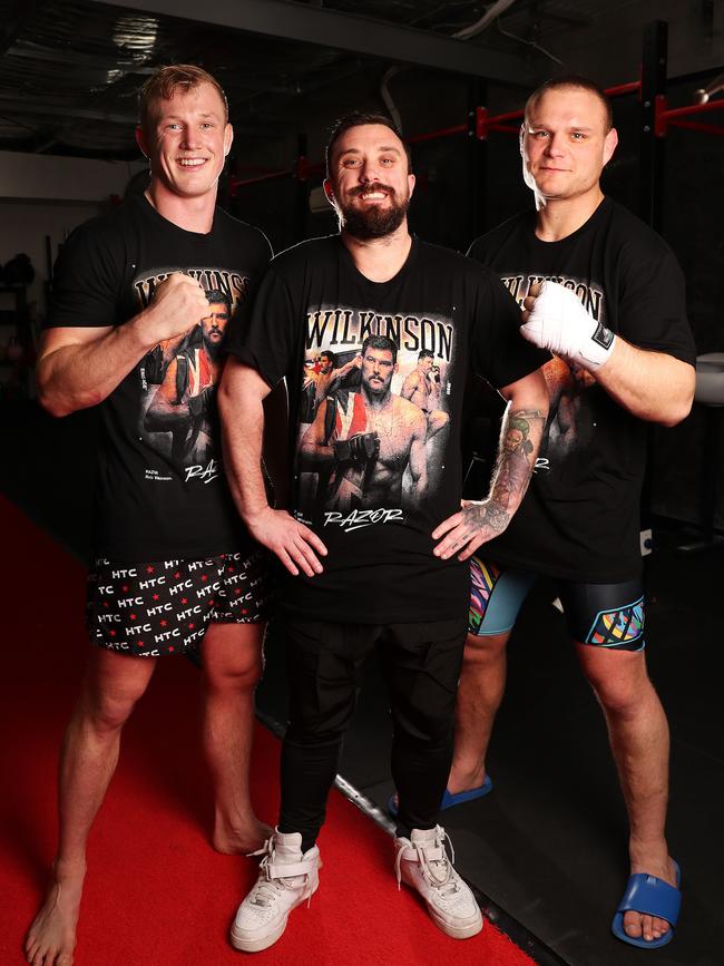 Tasmanian fans Tom Ackerly, Jeremy Green and Kahn Sandy wearing Rob Wilkinson t-shirts in celebration after his PFL world-championship winning fight in New York last year. Picture: Nikki Davis-Jones