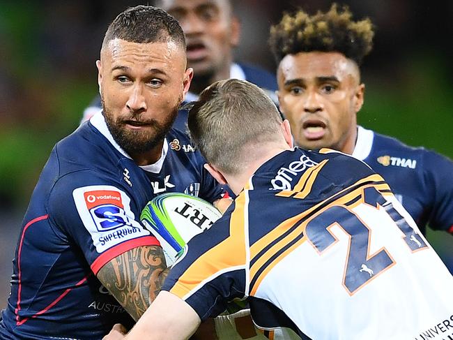 MELBOURNE, AUSTRALIA - MARCH 08: Quade Cooper of the Rebels is tackled by Ryan Lonergan of the Brumbies during the round four Super Rugby match between the Rebels and the Brumbies at AAMI Park on March 08, 2019 in Melbourne, Australia. (Photo by Quinn Rooney/Getty Images)