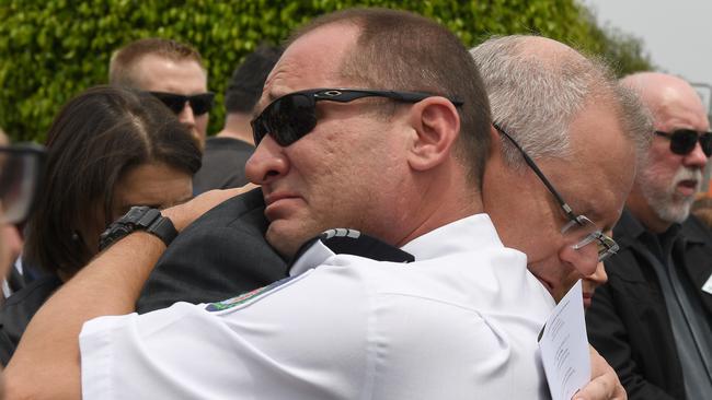 Prime Minister Scott Morrison hugs Horsley Park RFS captain Darren Nation during the funeral service of Andrew O'Dwyer at Our Lady of Victories Catholic Church on January 7, 2020 in Horsley Park. Photo: Dean Lewins-Pool/Getty Images