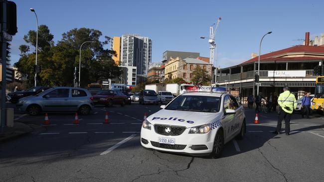 Traffic builds up on the corner of Morphett and Currie streets because of the burst water main. Picture: Simon Cross